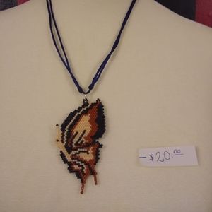 This is a beaded necklace of a butterfly
